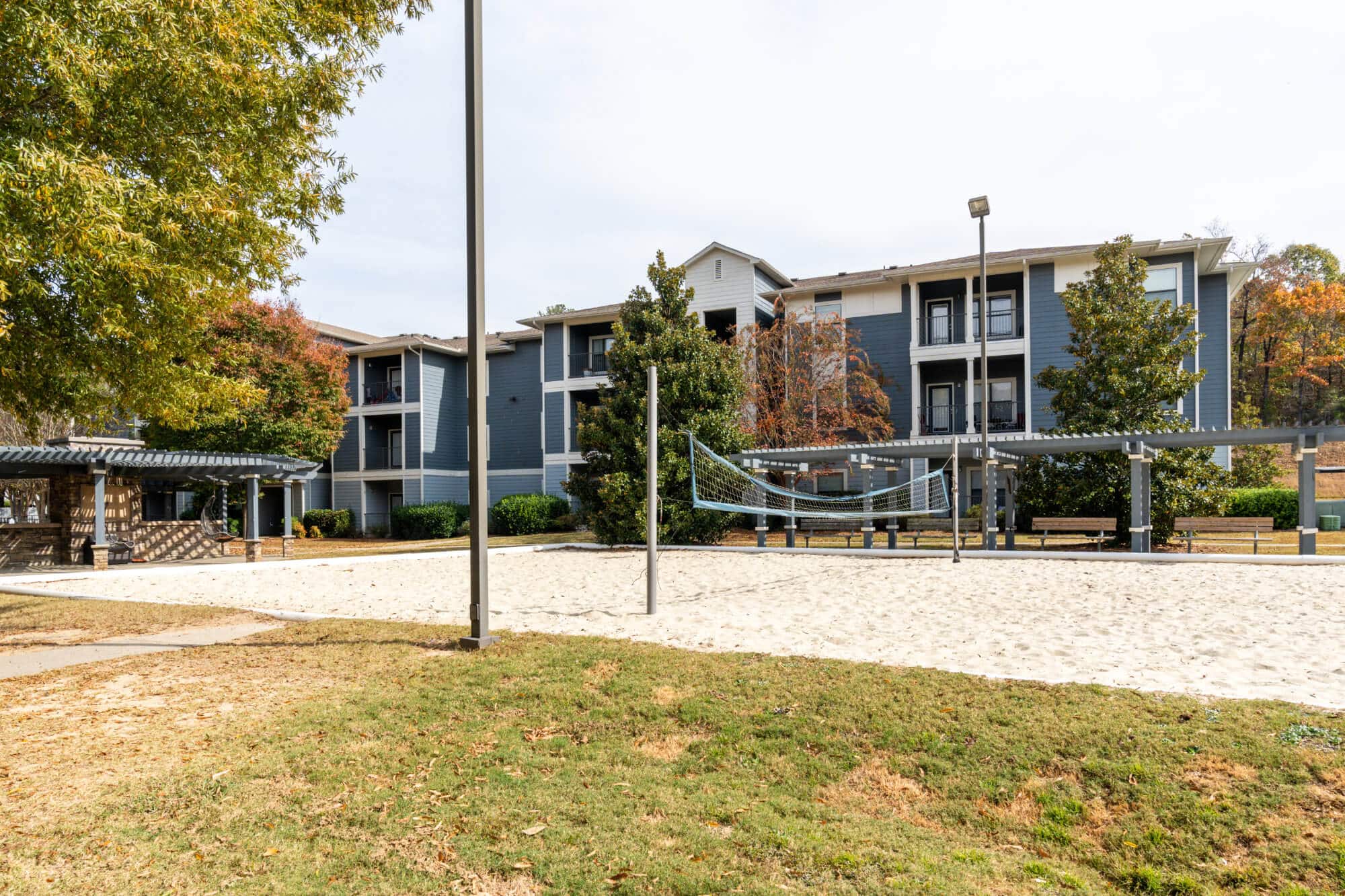 Sand volleyball court near apartments.