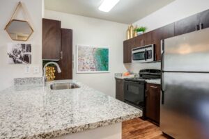Modern kitchen with granite countertops.