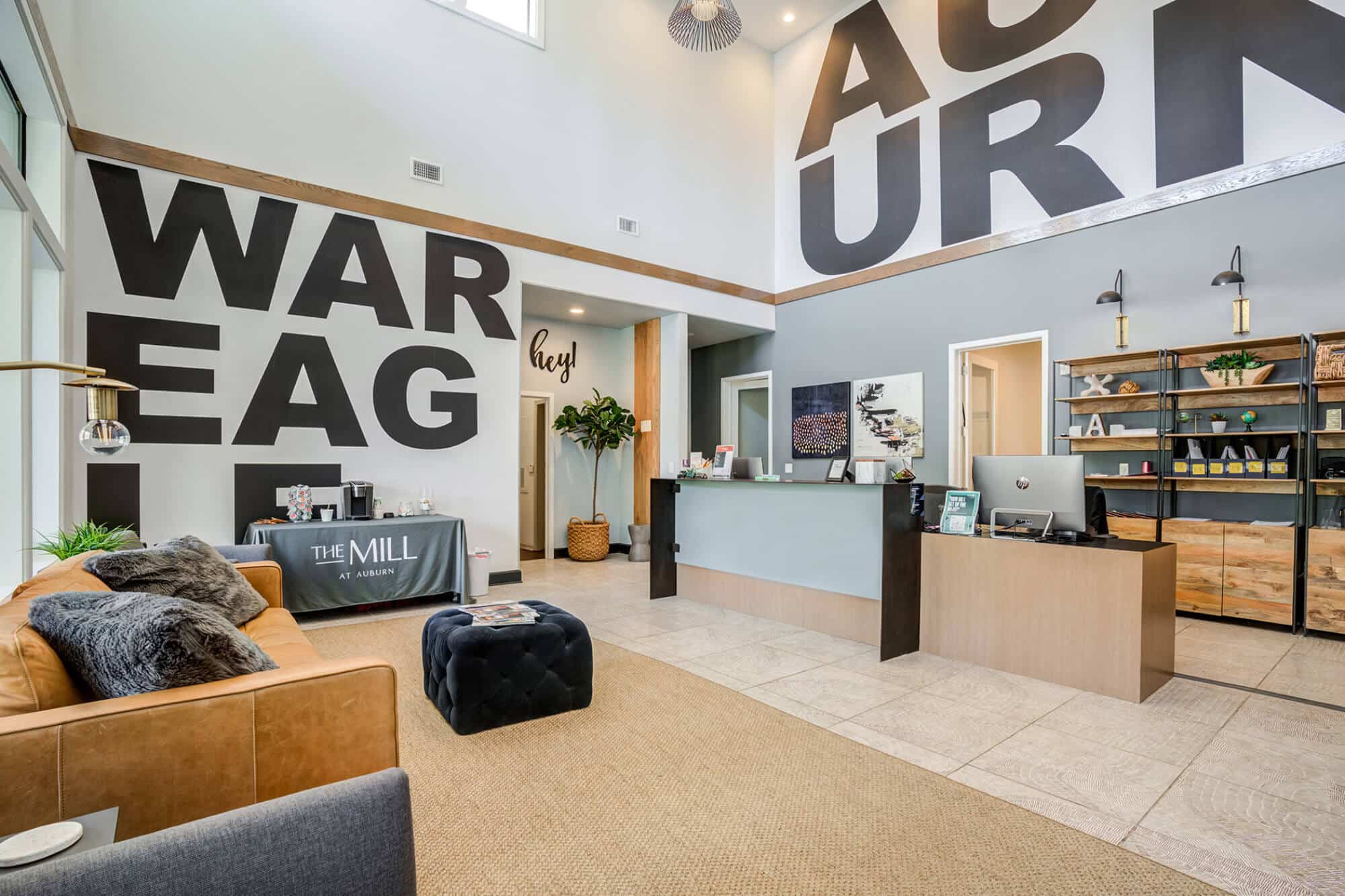 Modern leasing office with Auburn branding